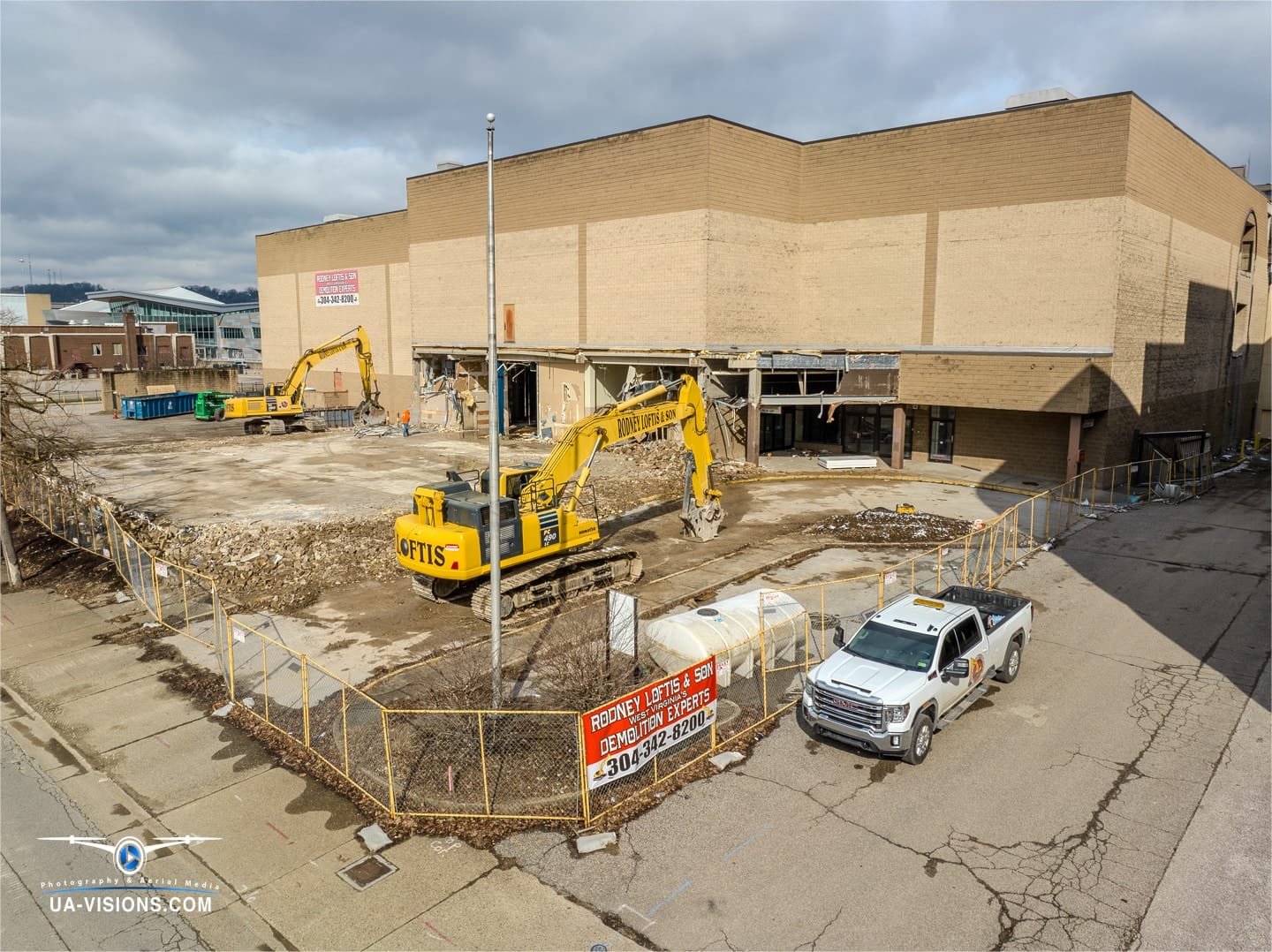 Rodney Loftis and Sons Contracting bringing down the Sears Building in Charleston, WV Aerial view of a sears demolition progression project of the Sears building at the Charleston Town Center Mall captured by UA-Visions