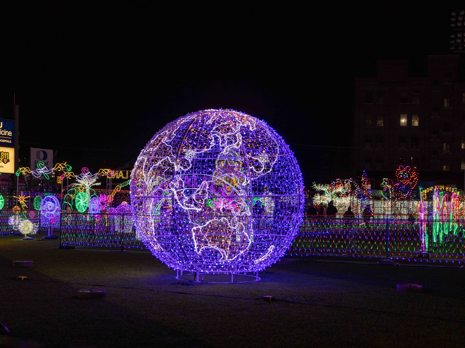 Globetrotting in Lights: Charleston's Artistic Display Spectacular globe light installation at Charleston's holiday event, photographed by UA-Visions.